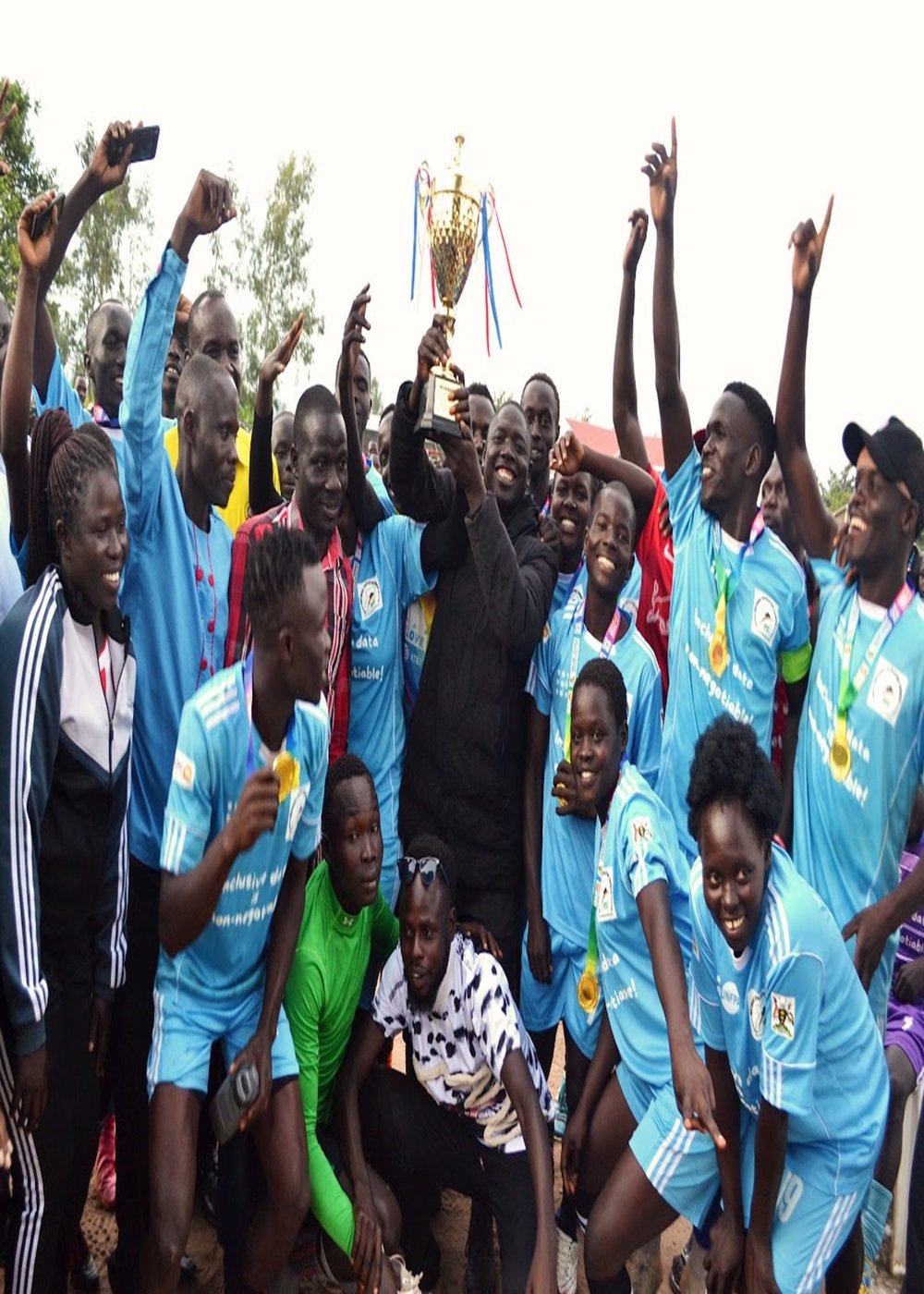 Winners of the World Population Day/ICPD30 football tournament Vurra County celebrate the achievement. PHOTO: UNFPA/Evelyn Matsamura Kiapi.