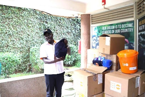 UNFPA Programme Analyst-SRHR/GBV Roy Asiku displays some of the humanitarian items donated through the Japanese government.