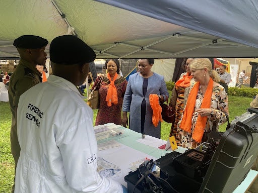 Minister of State (Gender) Hon. Peace Mutuzo, Ambassador of Sweden in Uganda H. E Maria Håkansson, UNFPA Representative Ms Gift Malunga and UN Women Representative Ms. Paulin Chiwangu visit the exhibition stall by the Uganda Police Forensics Unit. 