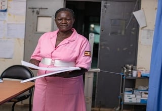 Grace Lakot stands proudly with 17 years of experience serving her community delivering babies in various places in Uganda. 
