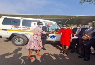 The Minister of Health, Hon. Dr. Jane Ruth Aceng (in red) receives keys for the Ambulance for Kamwenge district from the UNFPA R