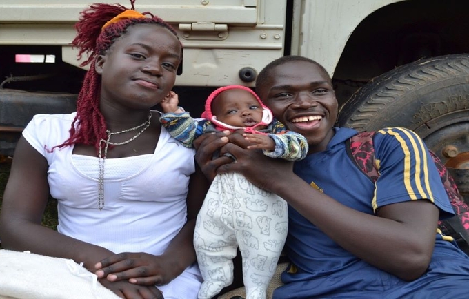 A happy couple with their baby. Increasing access to sexual and reproductive health services like family planning will enable mo