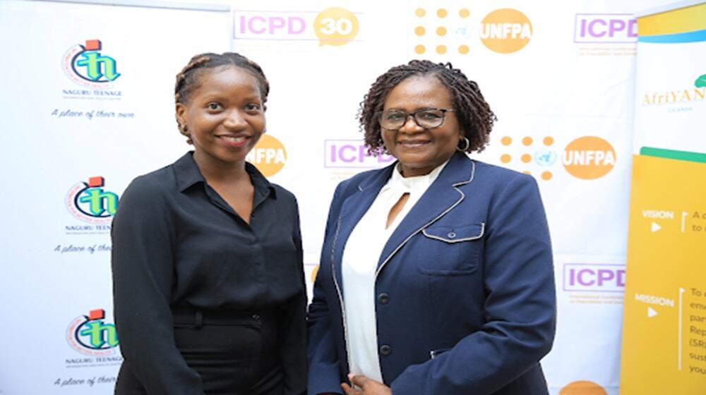 UNFPA Uganda Representative Ms. Gift Malunga (R) shares a moment with Ms Angel Babirye, President of AfriYAN East Southern Africa.