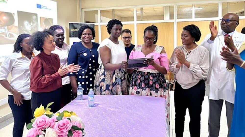 State Minister for Primary Healthcare, Hon. Muhanga Margaret (In pink blouse), launches the SBA project in Kawempe as others look on. PHOTO: UNFPA/Emmanet Nabwire