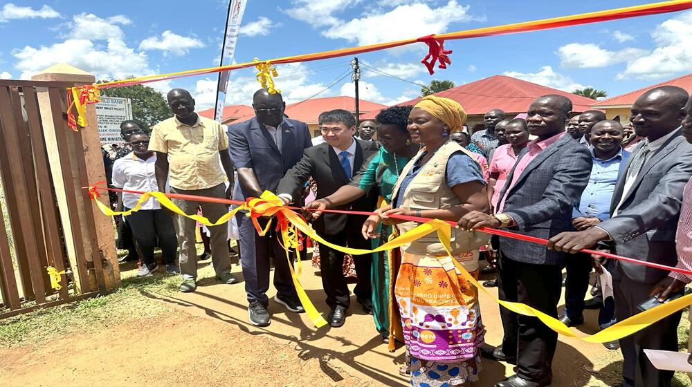 Minsiter Minister for Relief, Disaster Preparedness and Refugees Hon. Hilary Onek, Mr. Yoshimura Tomotaka, Deputy Ambassador of Japan to Uganda, Programme Coordinator, Integrated SRHR Juliana Mdamvetsa Lunguzi and Lamwo Distict leaders commissioning Palabek Kal Helath Centre IV on October 5.