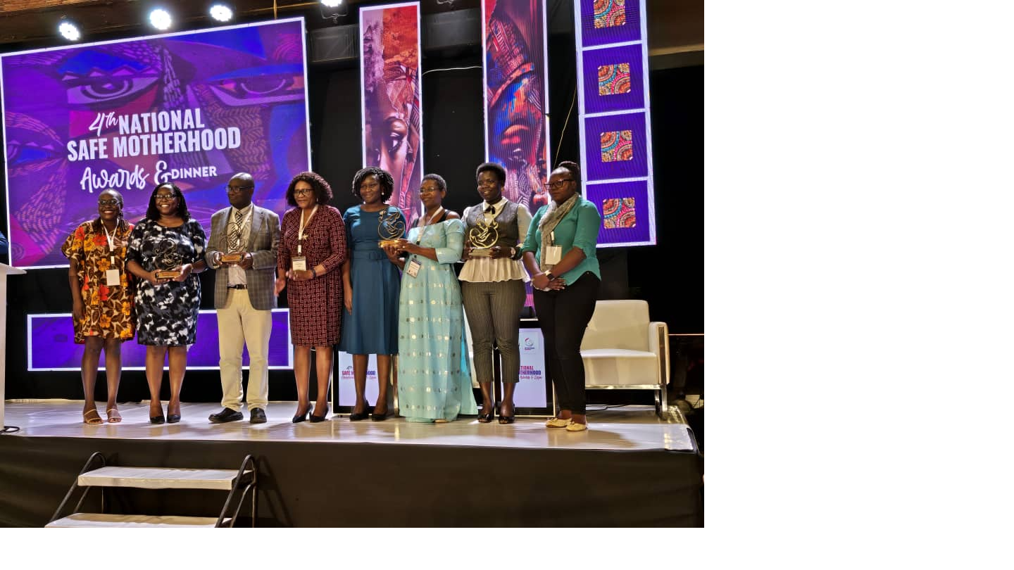 UNFPA Uganda Representative (C) presents an award to presents an award to Implementing Partners in recognition of their outstanding contribution to Family Planning and Maternal Health. This was at the  closure of the Safe Motherhood Conference October 31, 2025.