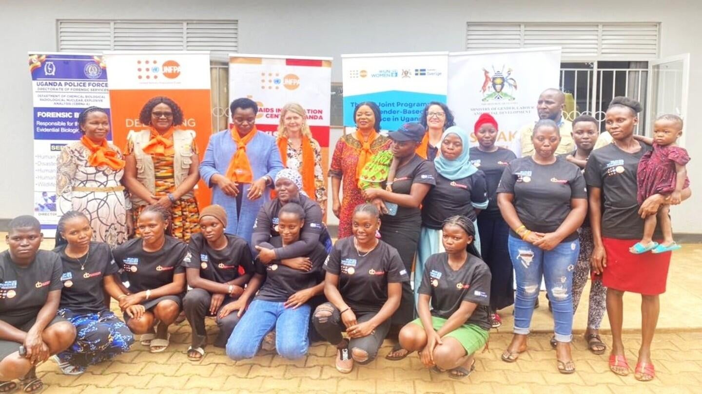 Minister of State (Gender) Hon. Peace Mutuzo, UNFPA Uganda Representative, Ms. Gift Malunga, UN Women Representative Ms. Paulina Chiwangu, Ambassador of Sweden H. E Maria Håkansson and other dignitaries pose with participants during the visit to Sauti -116 GBV Helpline to mark 16 Days of Activism against GBV. 