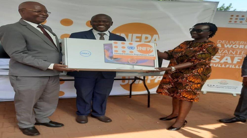 UNFPA Uganda Representative Dr. Mary Otieno (right) handing over the equipment to UBOS Executive Director Dr. Chris Mukiza (left