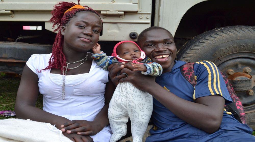 A happy couple with their baby. Increasing access to sexual and reproductive health services like family planning will enable mo